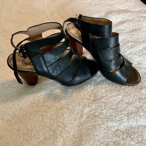 Black strappy sandals with heels.